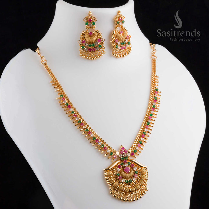 Magnificent splendid micro gold plated multi-color AD tilak pendant necklace with earrings, featuring a grand finish and intricate golden work - Sasitrends