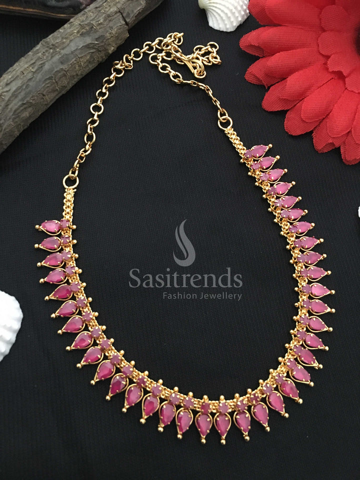Luxurious micro gold-plated necklace featuring intricately designed tilak stones and American diamond embellishments in a captivating ruby  - Sasitrends