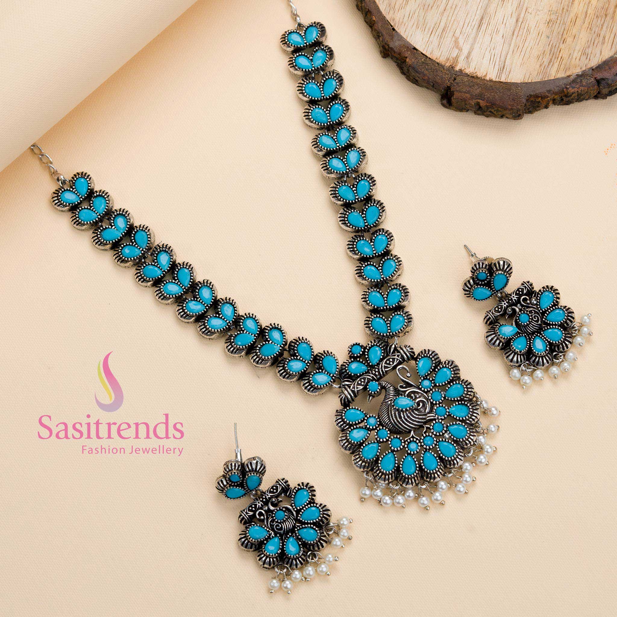Sky-blue stone oxidised peacock pendant necklace with pearl details, a traditional party jewellery piece radiating a refreshing aura – Sasitrends