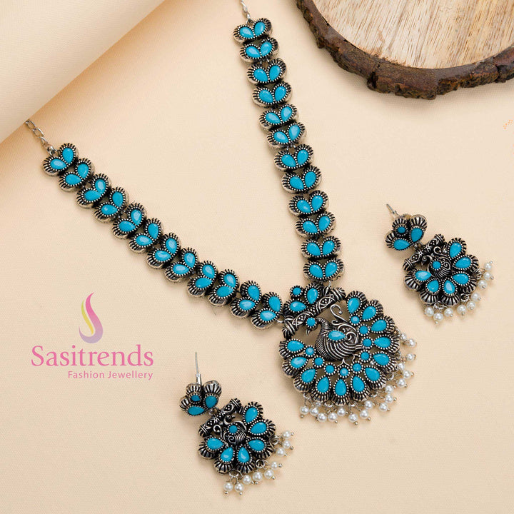 Sky-blue stone oxidised peacock pendant necklace with pearl details, a traditional party jewellery piece radiating a refreshing aura – Sasitrends
