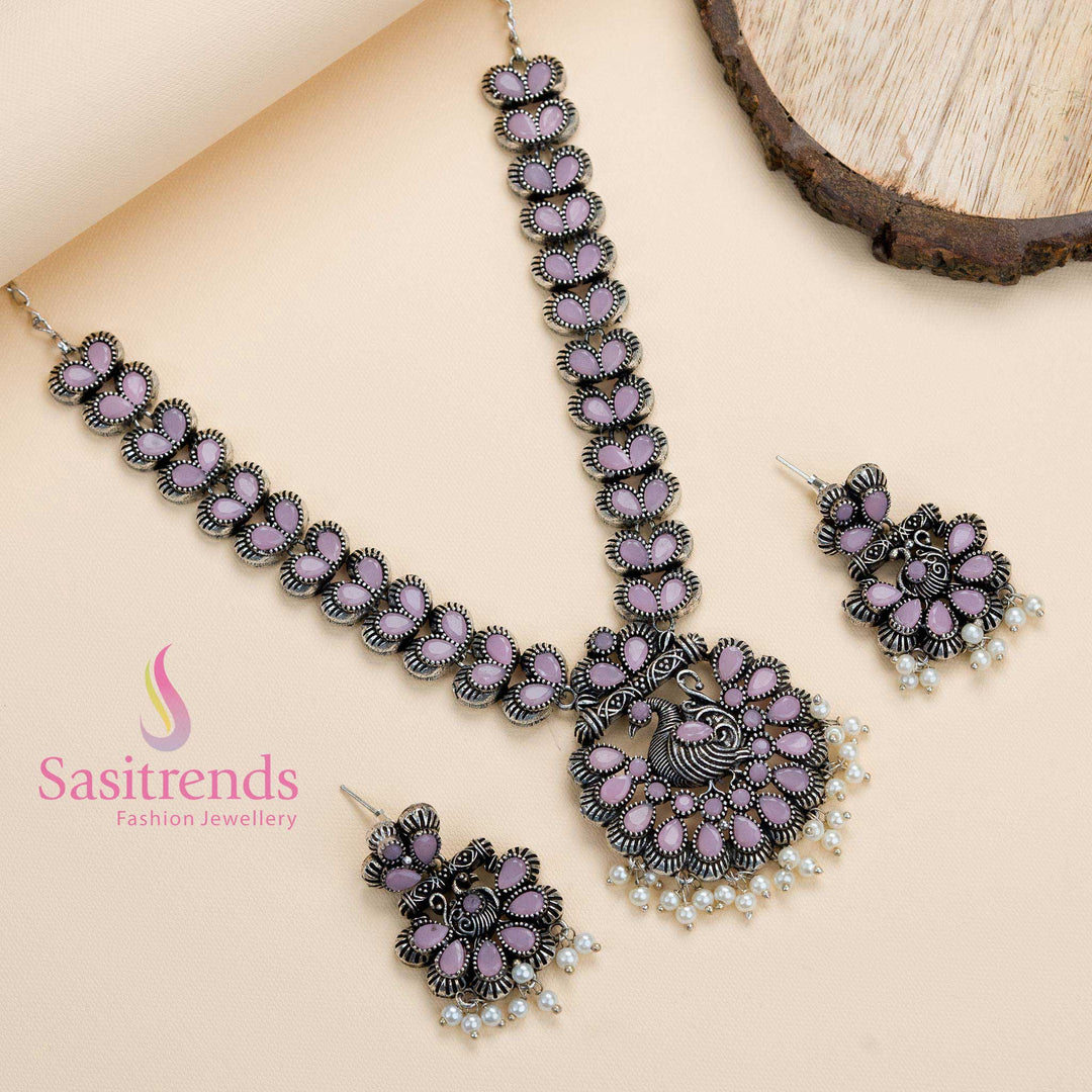 Oxidised silver peacock pendant jewellery set with pink stones and pearls, designed with vibrant ethnic flair for celebrations and gatherings – Sasitrends