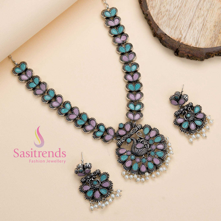 Dual-tone oxidised peacock pendant set in pink and mint stones with pearls, a vibrant ethnic partywear piece brimming with grace – Sasitrends