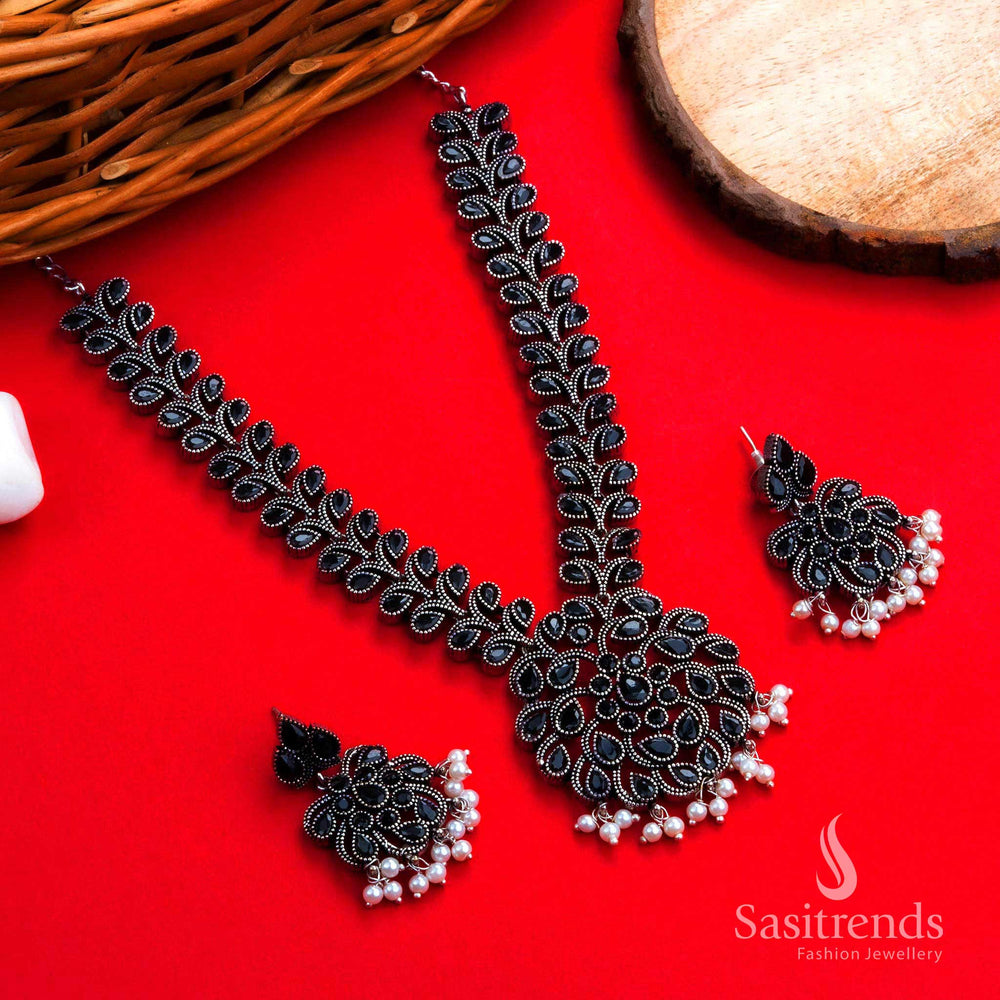 Elegant vintage-inspired oxidised silver floral black stones necklace with matching pearl drop earrings, a striking partywear jewellery set for bold and graceful women – Sasitrends