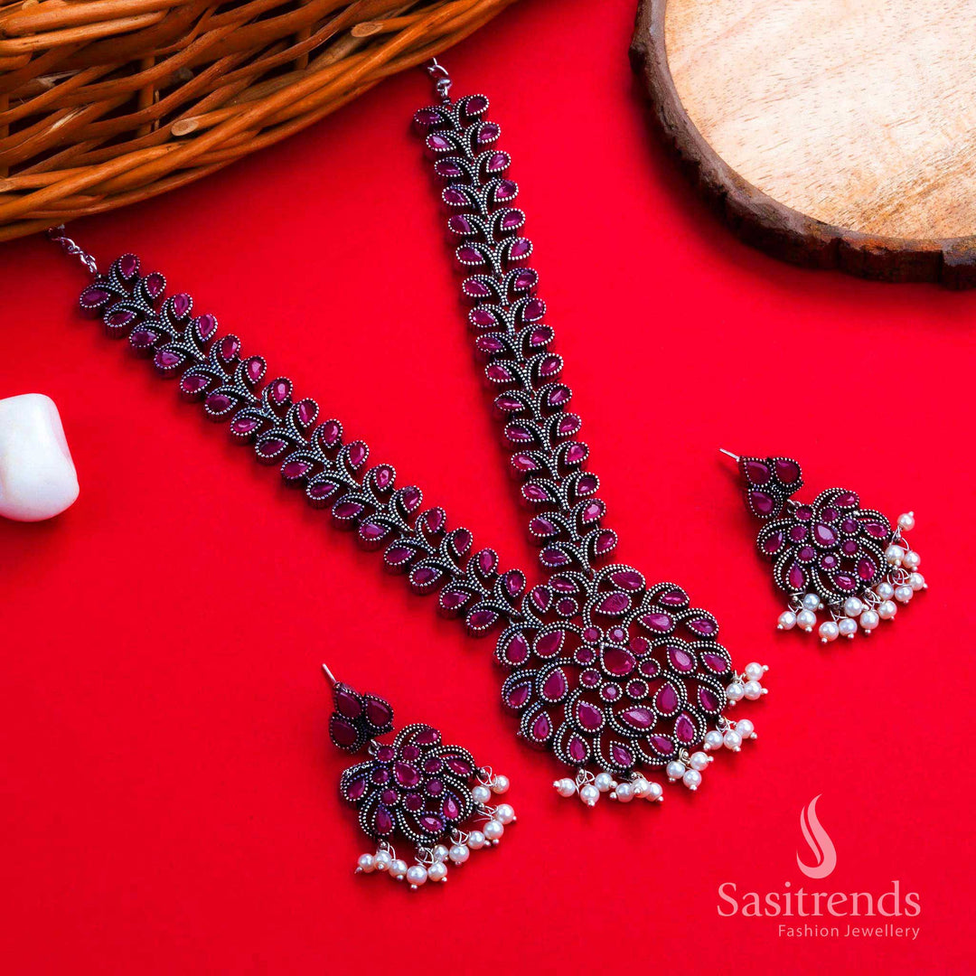 Royal oxidised silver ruby floral necklace set with charming earrings, a perfect women’s jewellery choice for celebrations, weddings, and festive glamour – Sasitrends