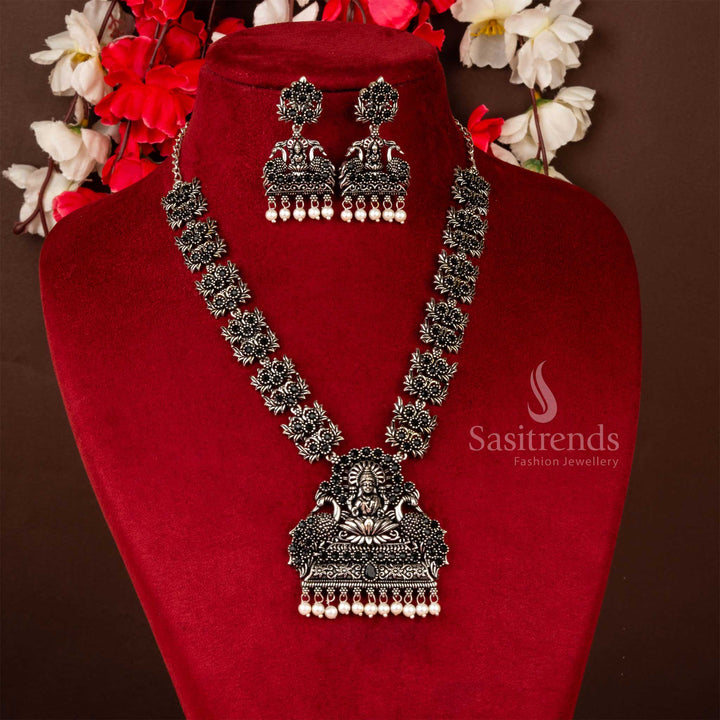 Mesmerizing Lakshmi and Peacock Oxidised Stones Jewellery Set with Pearl Drops