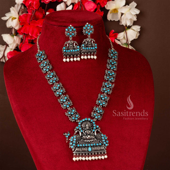 Soothing sky-blue Lakshmi and peacock oxidised stone jewellery set with pearl drops, crafted for graceful traditional style and devotional sophistication – Sasitrends