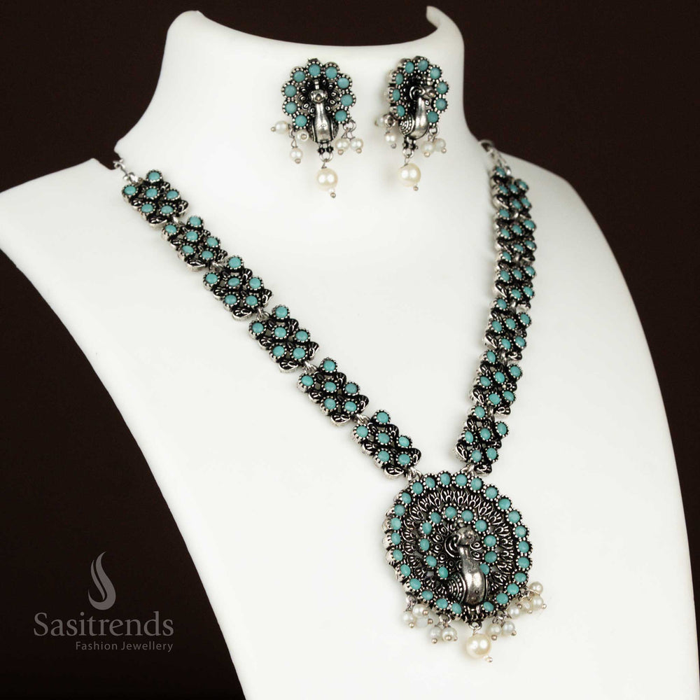 Cool mint oxidised necklace featuring a dancing peacock pendant and pearl earrings – a fresh and refined jewellery set for stylish ethnic celebrations from sasitrends