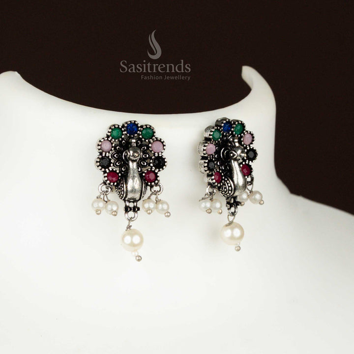 Colourful oxidised Earrings with dancing peacock motif, pearl charms, and earrings – a vibrant and traditional party jewellery piece with festive flair from sasitrends