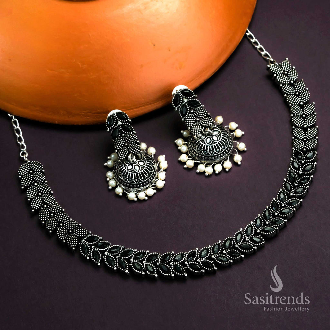 Elegant Black Oxidised Leaf Stones Jewellery With Dramatic Touch And Dome Pearl Jhumkas - Sasitrends