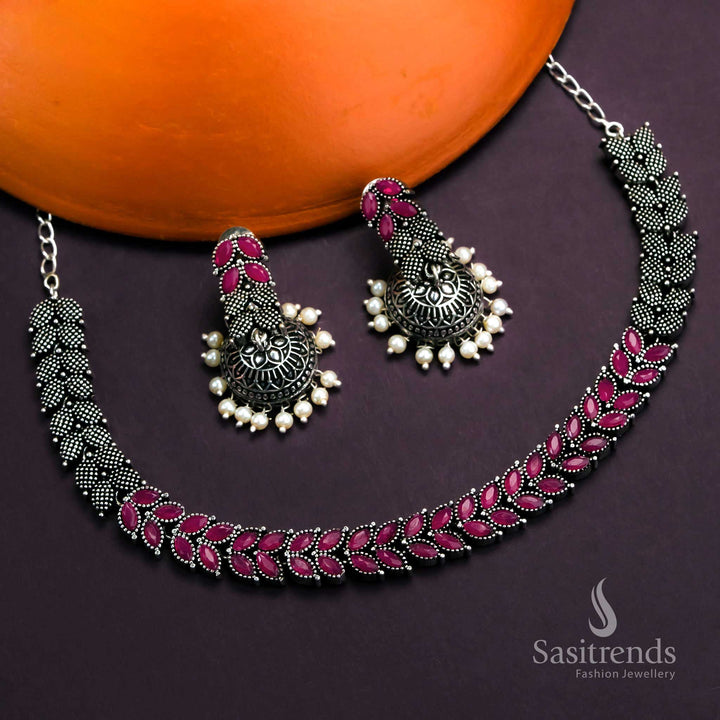 Radiant Ruby Tone Oxidised Jewellery Set With Floral Leaf Stone Work And Elegant Pearl Jhumkas - Sasitrends