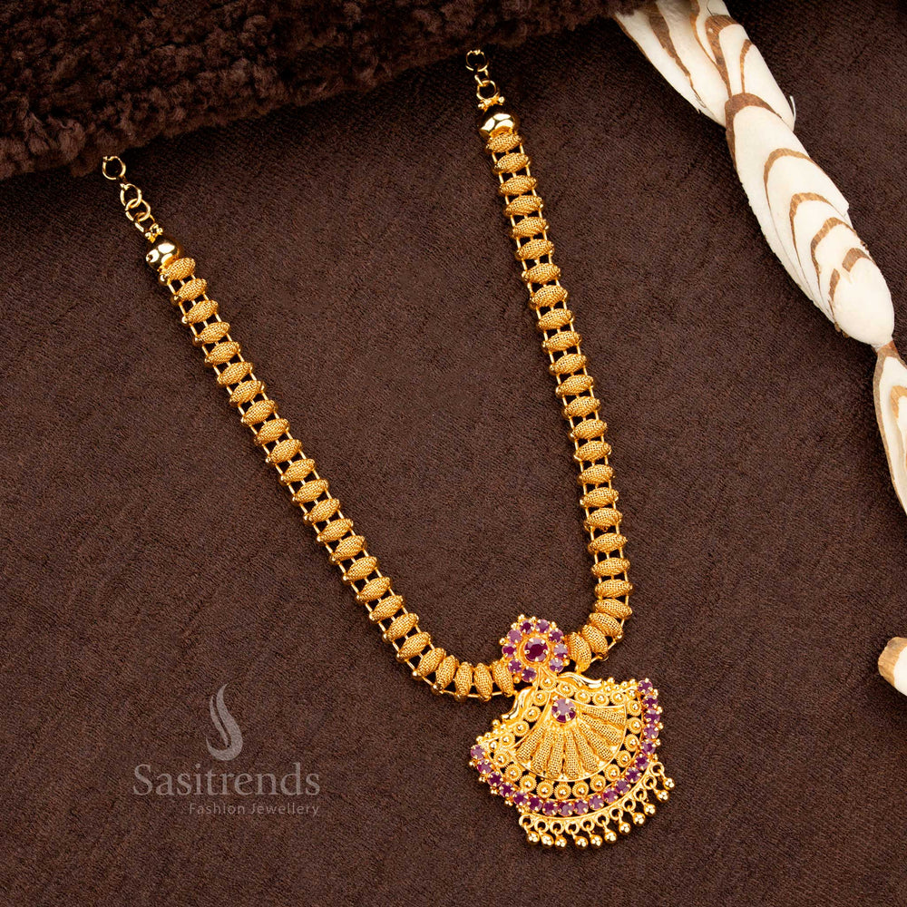 Majestic and regal 1-gram micro gold-plated necklace with a uniquely designed Tilak-shaped pendant, studded with dazzling ruby AD stones - Sasitrends