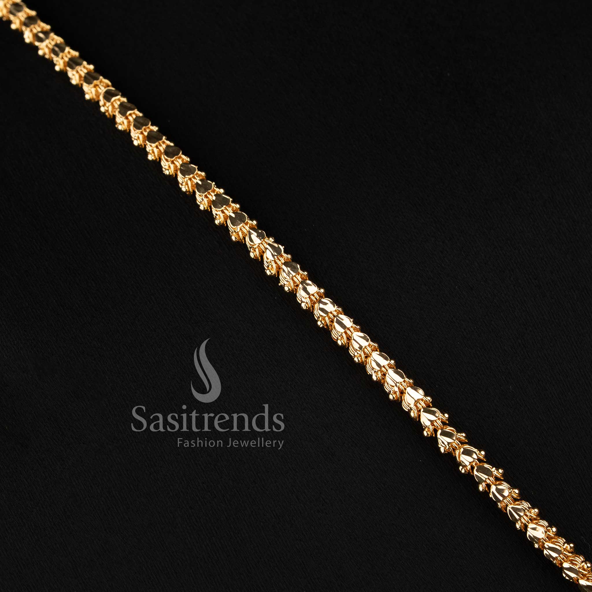 Elegant traditional-style capsule link long chain with a stone-studded floral mango motif centerpiece.