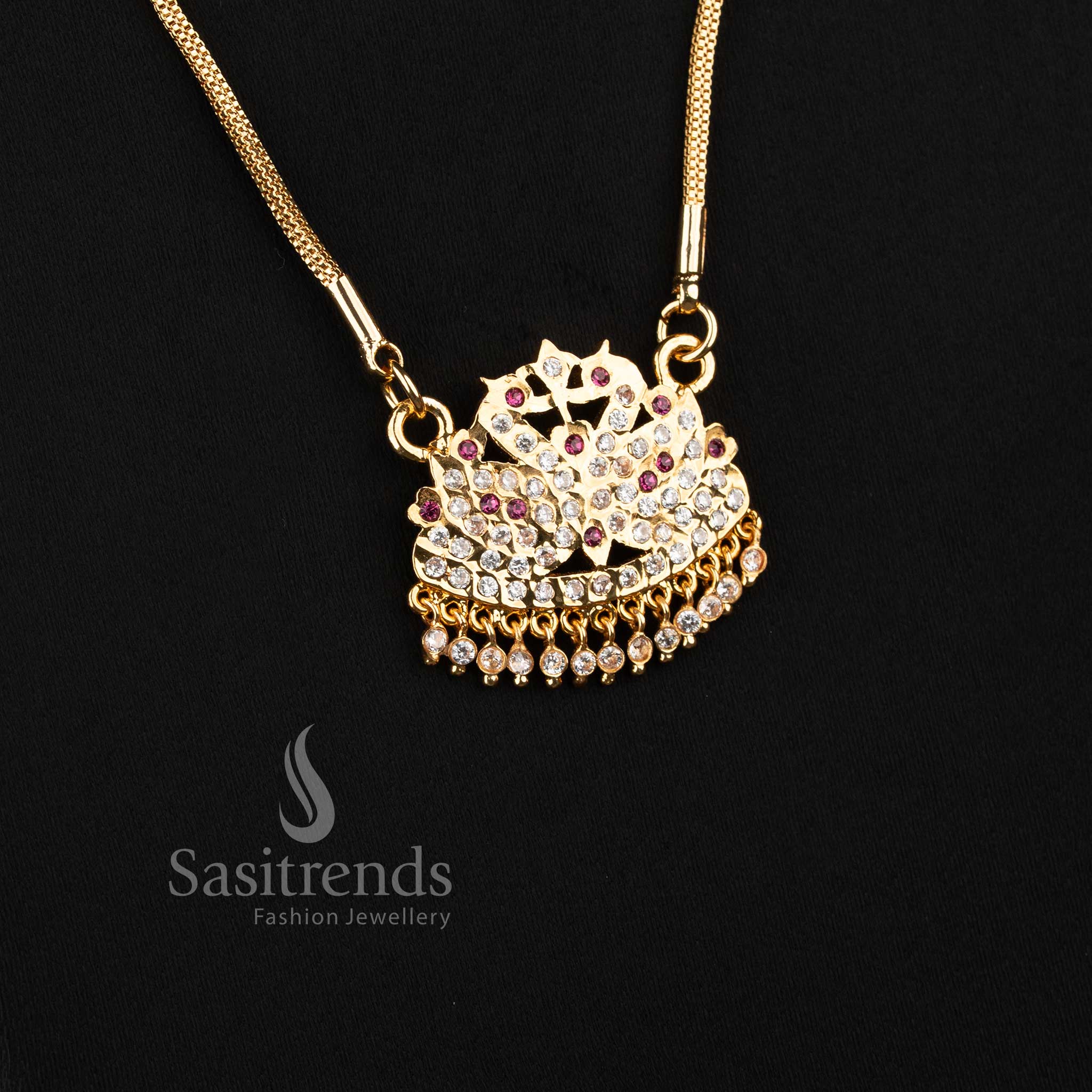 Close-up of an elegant traditional wear mesh chain layout with a stone-studded semicircular bird motif pendant.