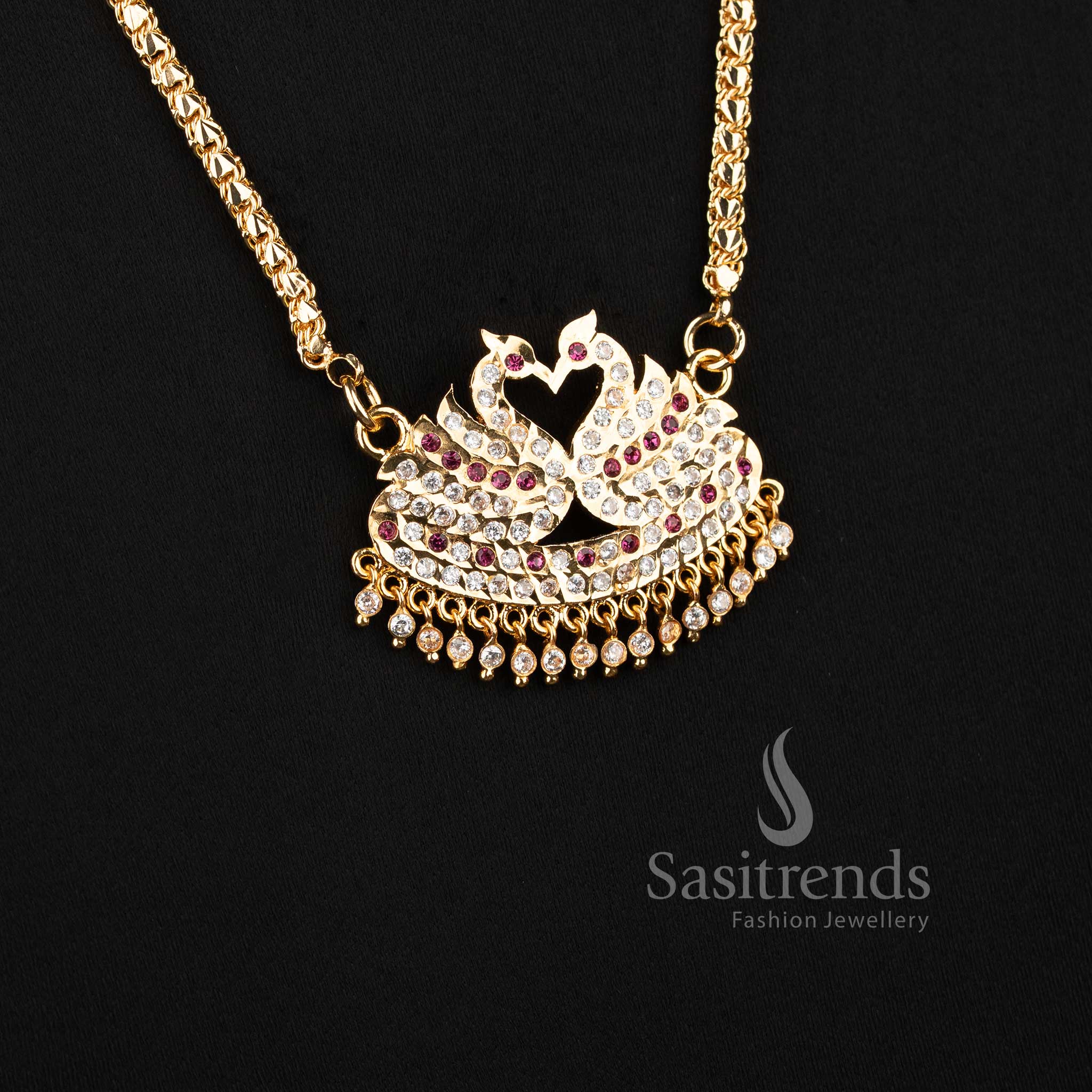 Close-up of an elegant traditional wear interlocking lotus bud chain layout with a stone-studded semicircular swan motif pendant.