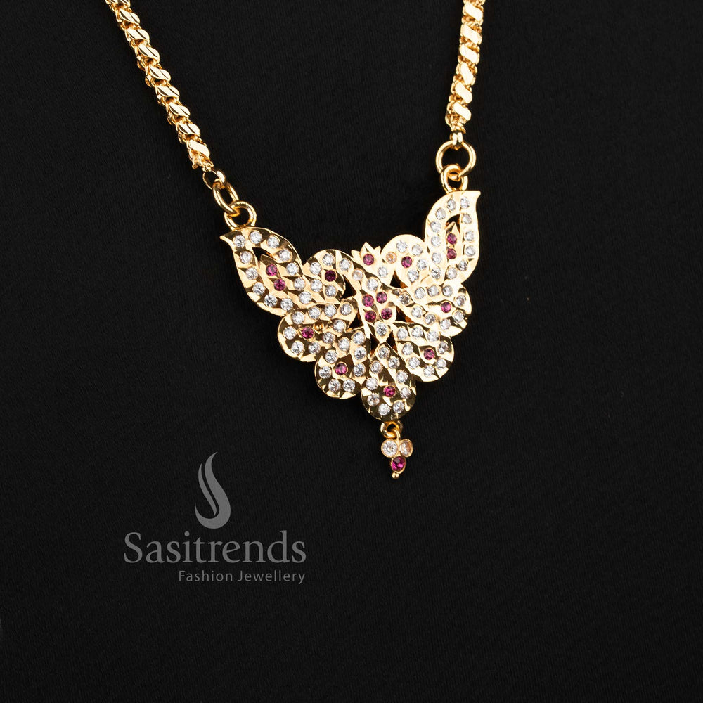 Close-up of an elegant traditional wear interlocking S-cut chain layout with a stone-studded leaf crest motif pendant.