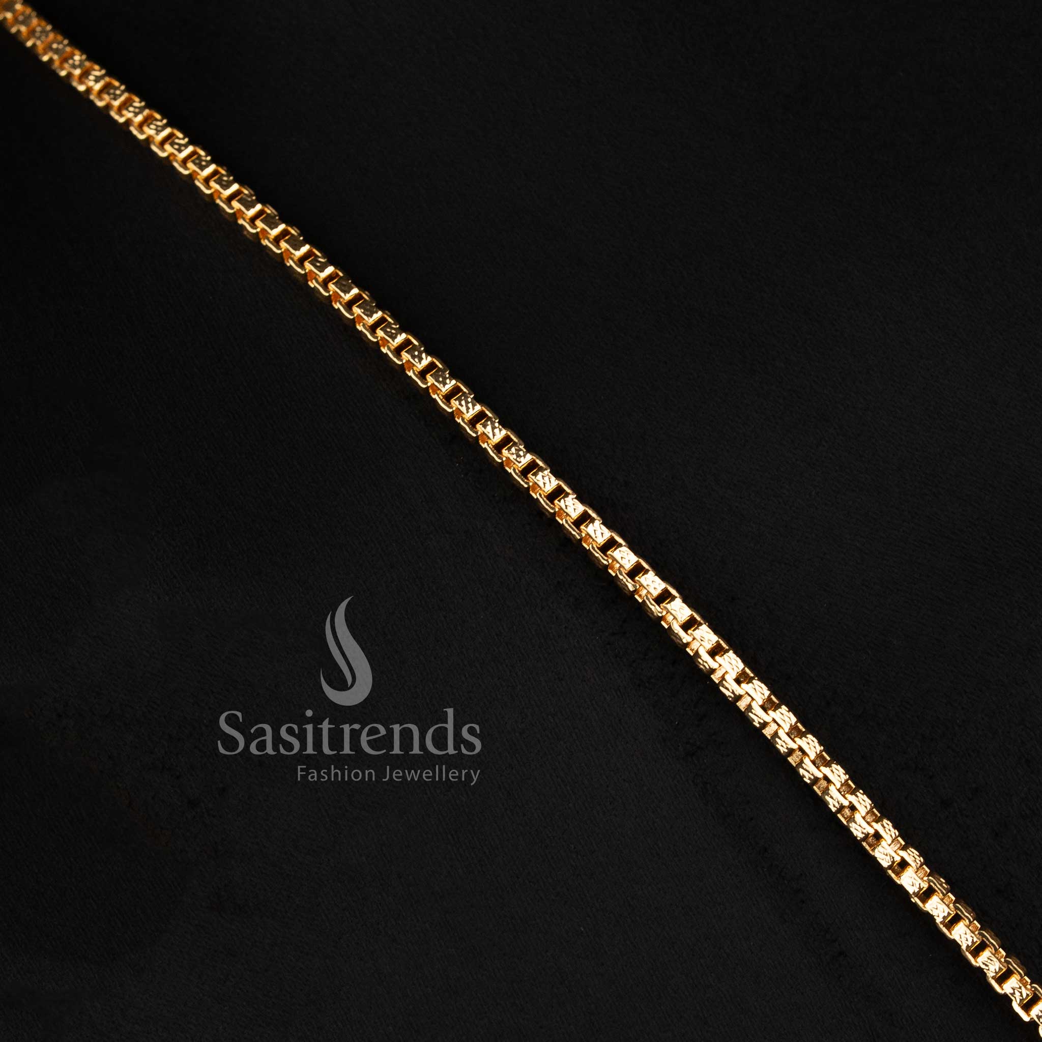 Close-up of an elegant traditional wear interlocking cube box chain layout with a stone-studded bird motif semicircular pendant.