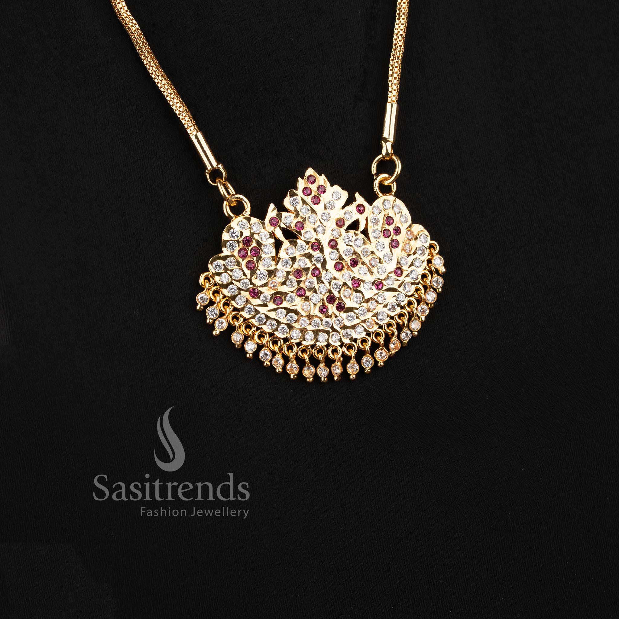 Close-up of an elegant traditional wear interlocking mesh chain layout with a stone-studded bird motif semicircular pendant.
