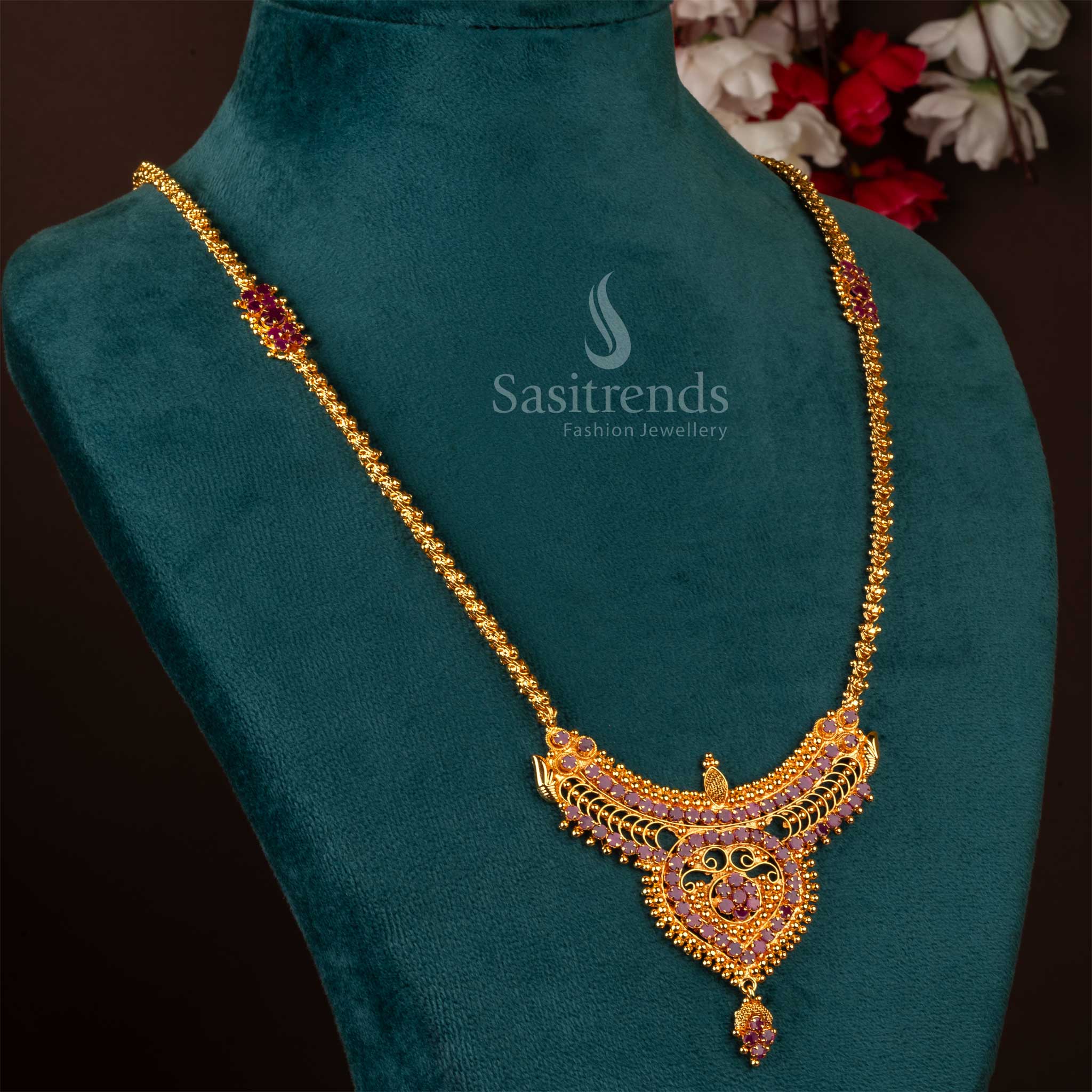 Grace of the goddess flows through this ruby temple pendant necklace, micro gold plated to perfection and designed in classic South Indian tradition – a radiant piece for festive and bridal jewellery moments – Sasitrends