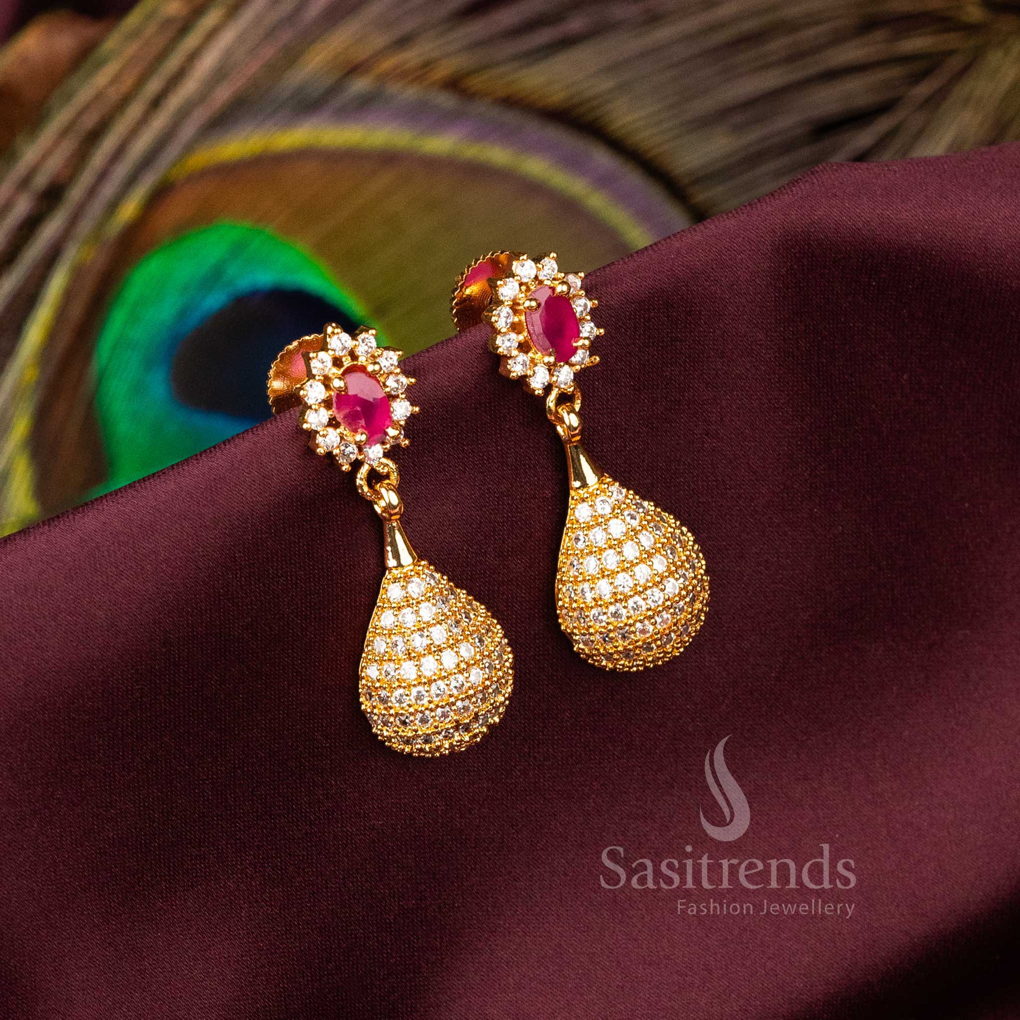 Chic traditional dangler earrings in a white-ruby combination, micro gold plated with petal-inspired design and sparkling AD stones – A regal floral accessory for ethnic jewellery lovers – Sasitrends