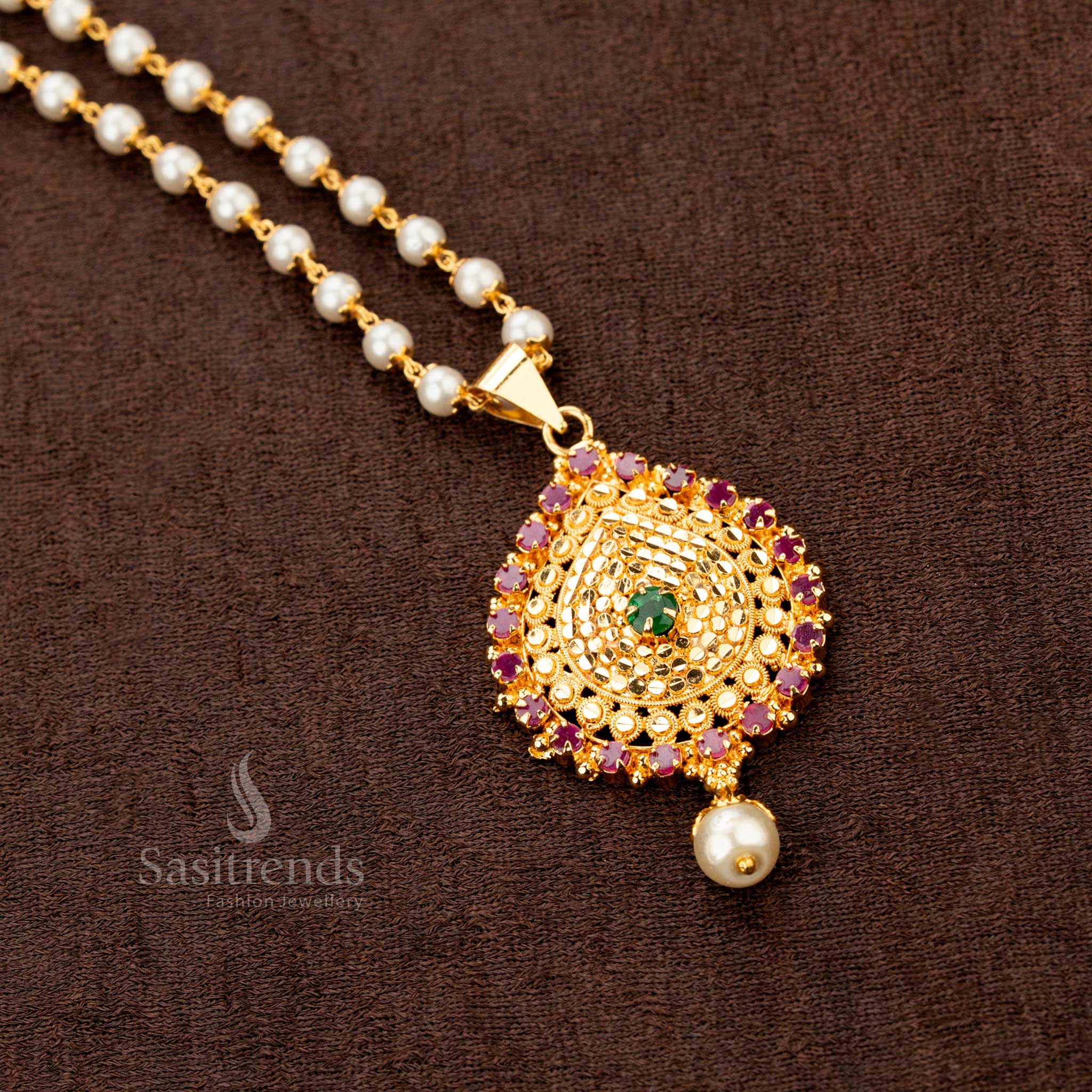 Exquisite traditional festive necklace featuring a radiant ruby-green American Diamond stone pendant, elegantly placed on a micro gold-plated single-layer pearl mala for a regal charm - Sasitrends