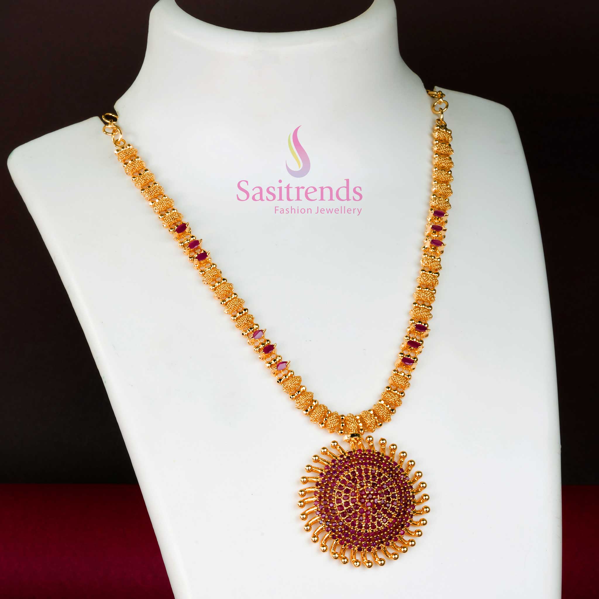 Royal ruby gleam in this micro gold plated sun locket necklace with radiant American diamond detailing and floral embellishments – an elegant wedding jewellery piece – Sasitrends