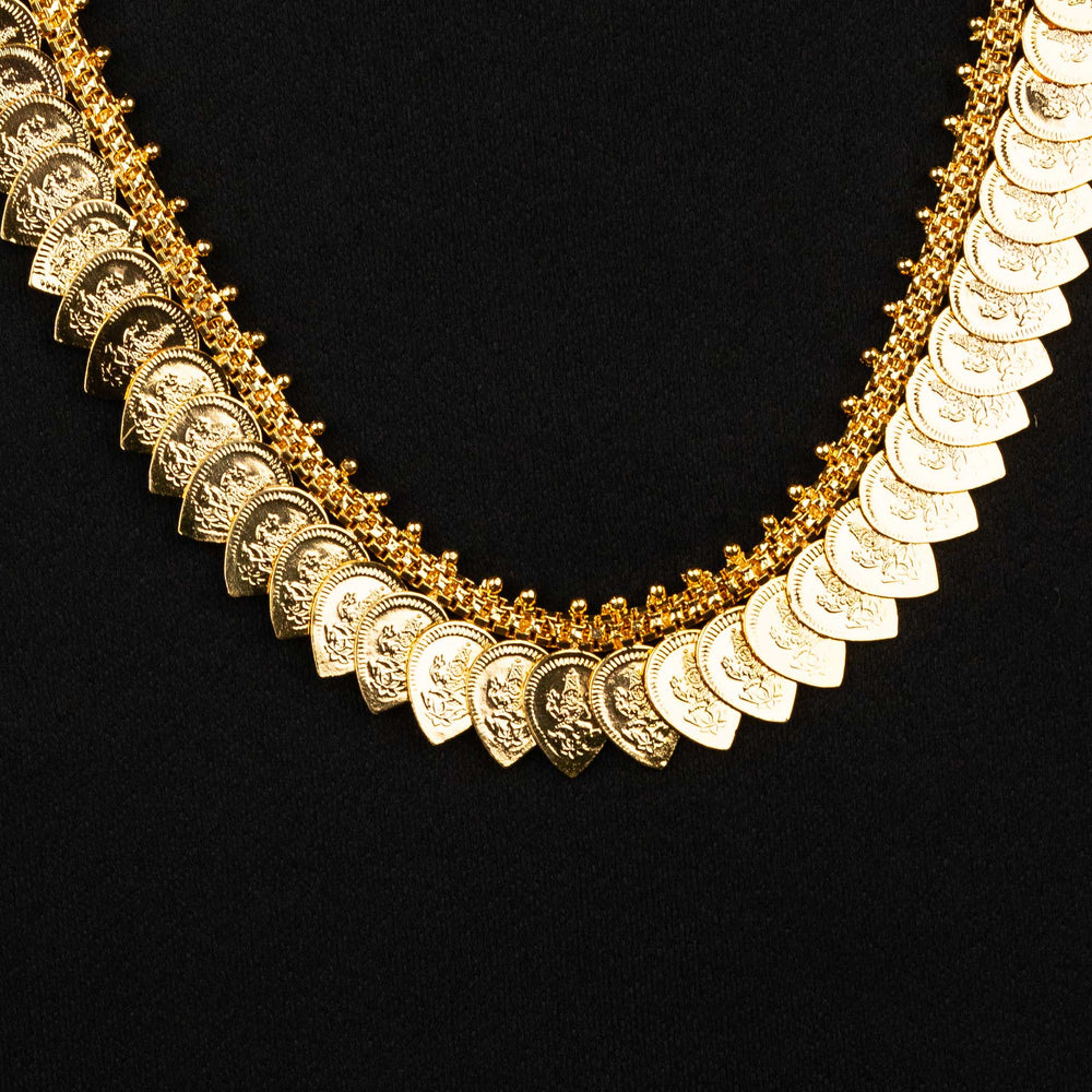 Elegant traditional necklace showcasing a leaf-inspired pattern and Lakshmi-themed craftsmanship in micro gold plating - Sasitrends