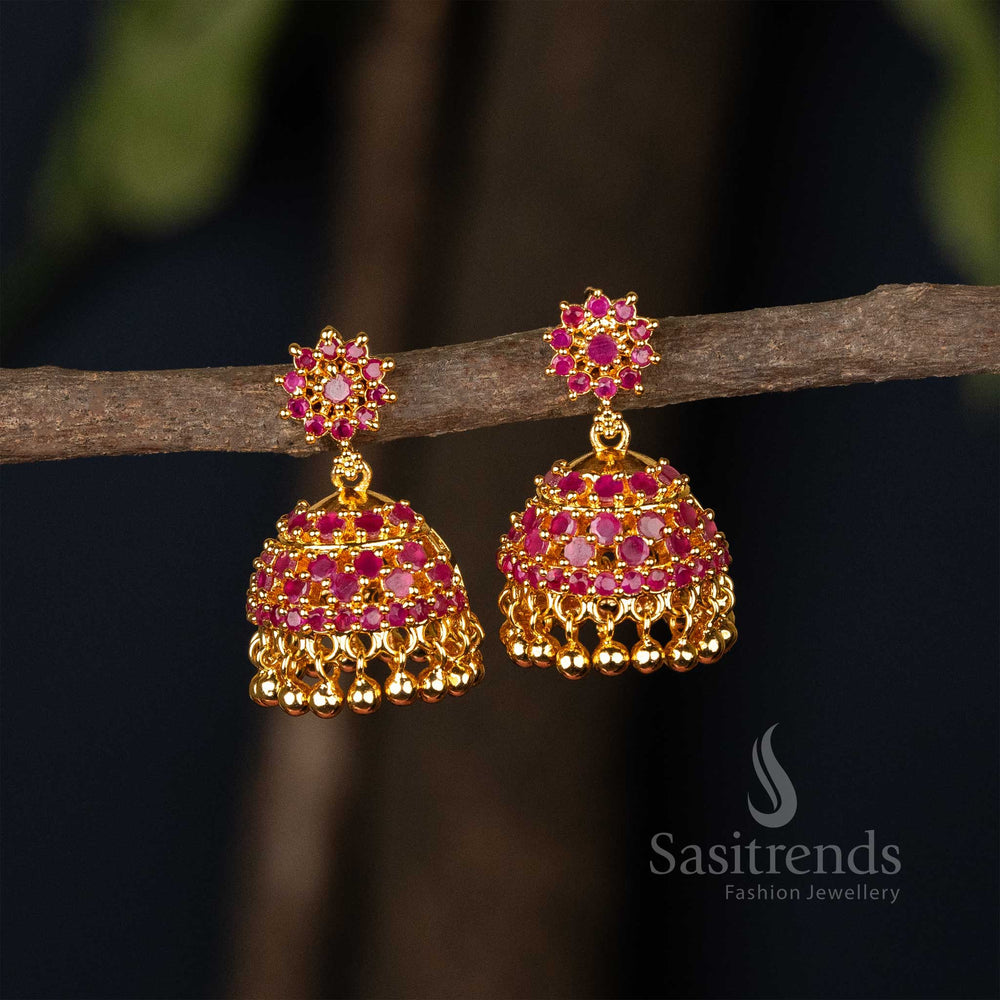 Regal ruby micro gold plated traditional jhumka earrings with floral carvings, kemp stone highlights and graceful pearl drop accents – ideal for festive wear – Sasitrends

