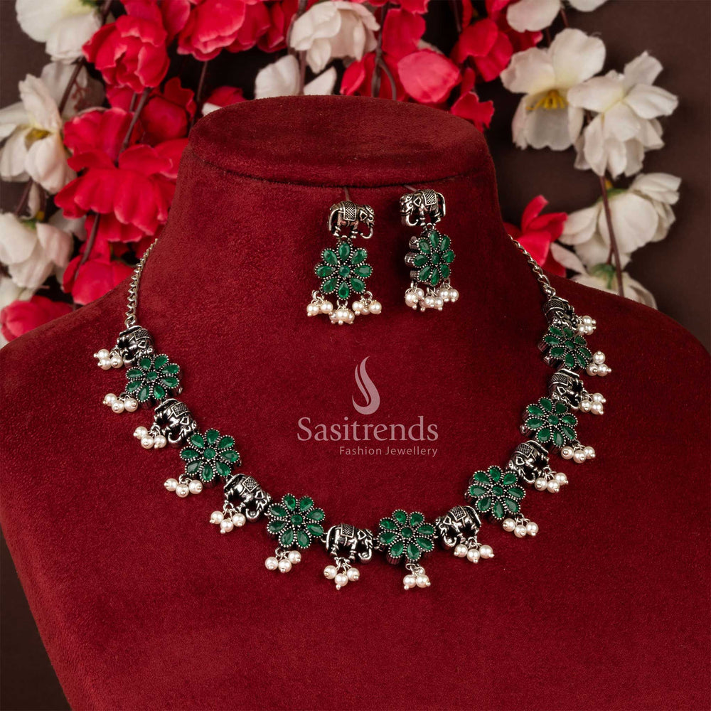 Lush Green Oxidised Silver Jewellery Set with Artistic Elephant Patterns, Flower Charms and Delicate Pearl Detailing – Sasitrends