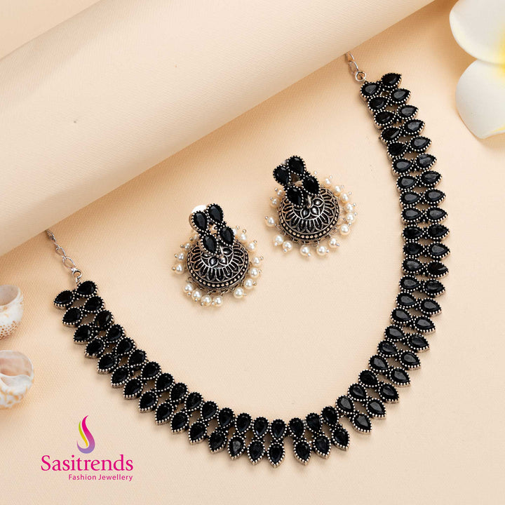 Bold black oxidised silver necklace paired with pearl jhumkas, a stone jewellery set perfect for stylish evening wear – Sasitrends