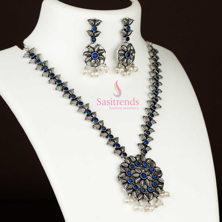 Vintage-inspired blue oxidised silver jewellery set with pearl accents, floral-leaf pendant, and tribal design aesthetics for an ethnic statement – Sasitrends