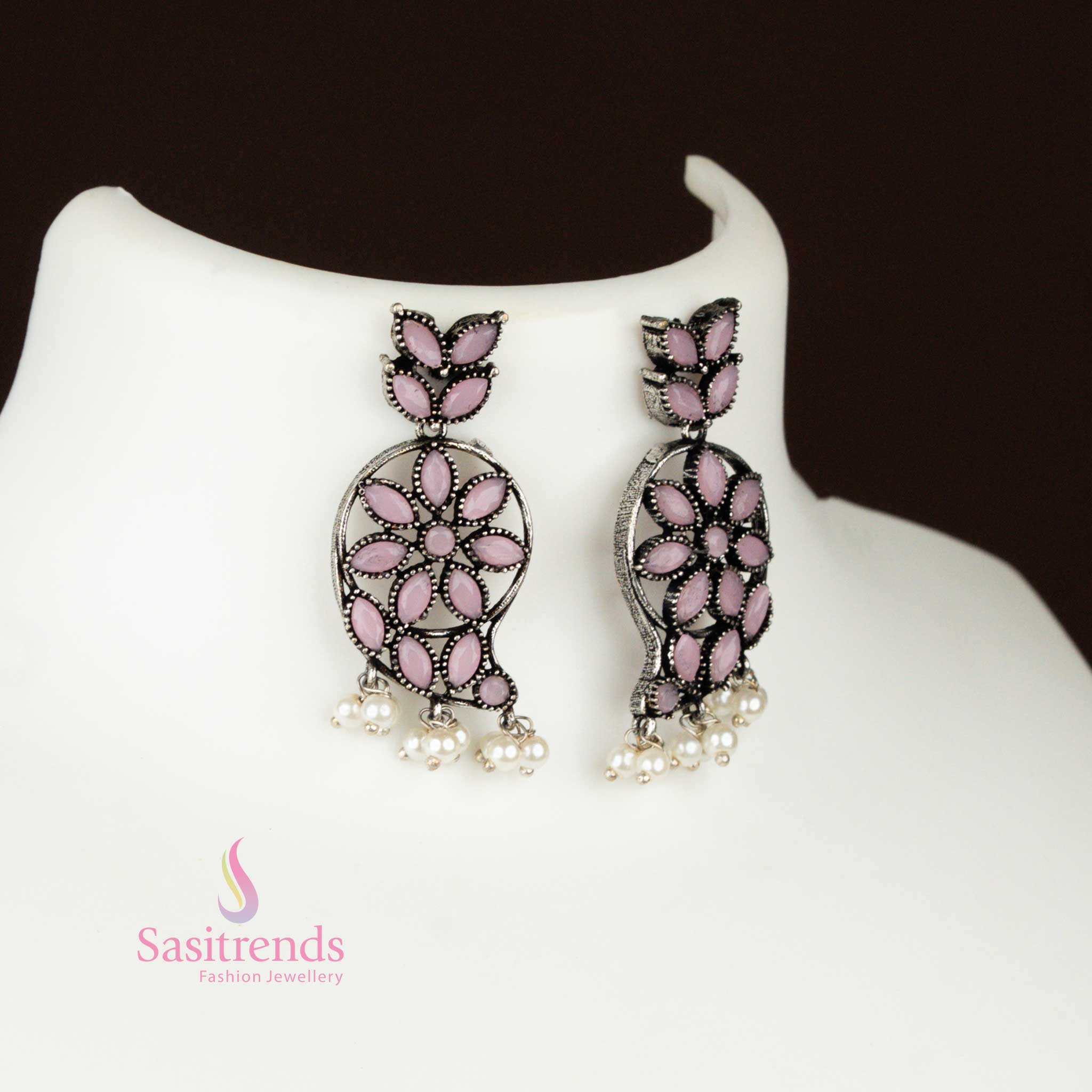 Elegant baby-pink oxidised German silver earrings with a traditional mango-shaped pendant and pearl highlights, a graceful tribal floral jewellery set – Sasitrends