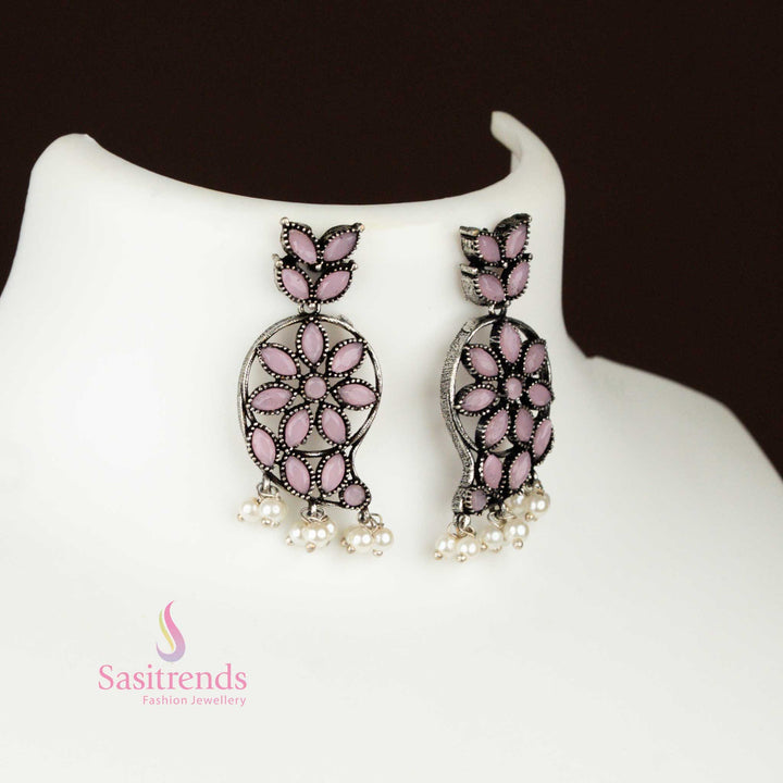 Elegant baby-pink oxidised German silver earrings with a traditional mango-shaped pendant and pearl highlights, a graceful tribal floral jewellery set – Sasitrends