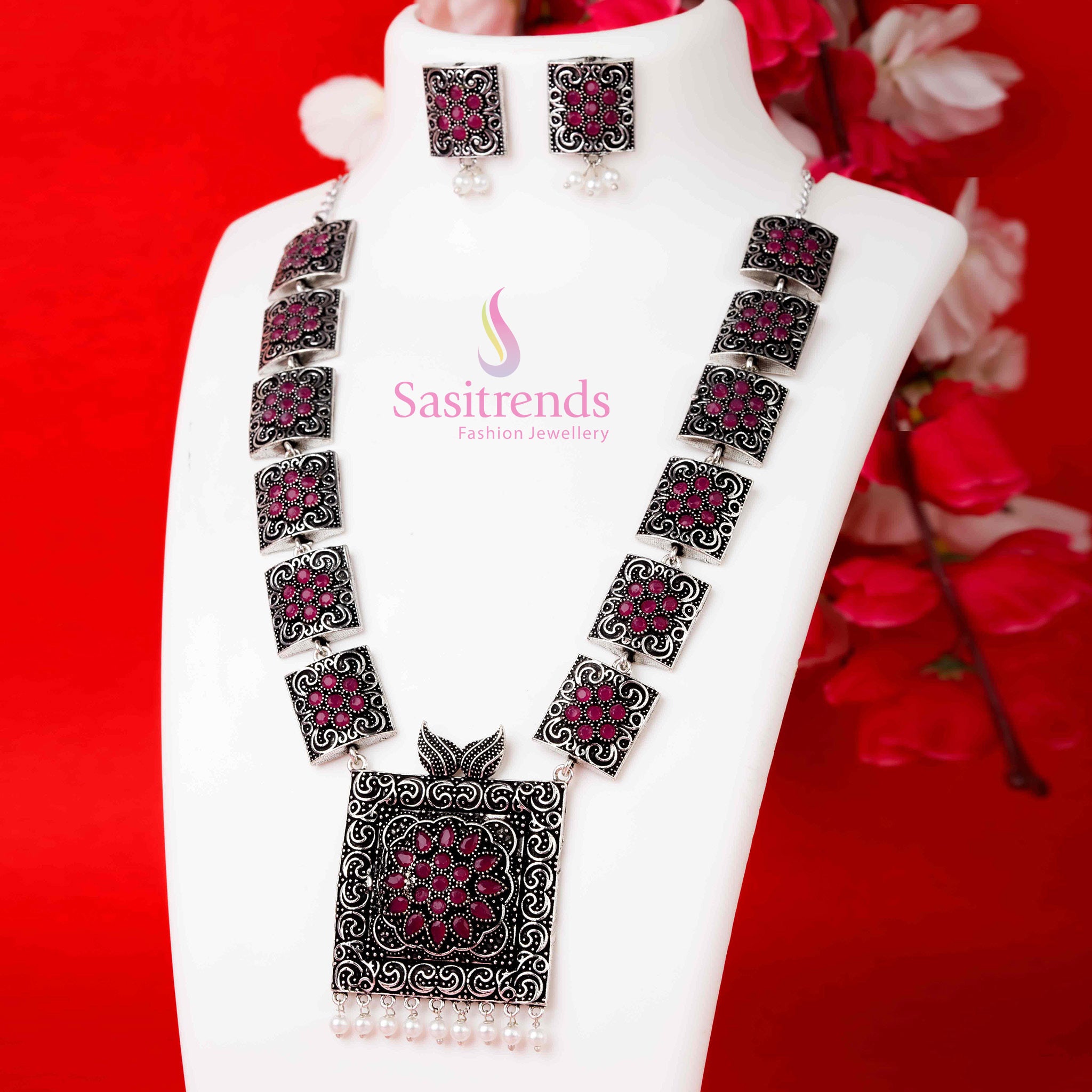 Traditional oxidised ruby coloured pearl jewellery set with stone-studded necklace and jhumka earrings, radiating festive charm and ethnic richness – Sasitrends