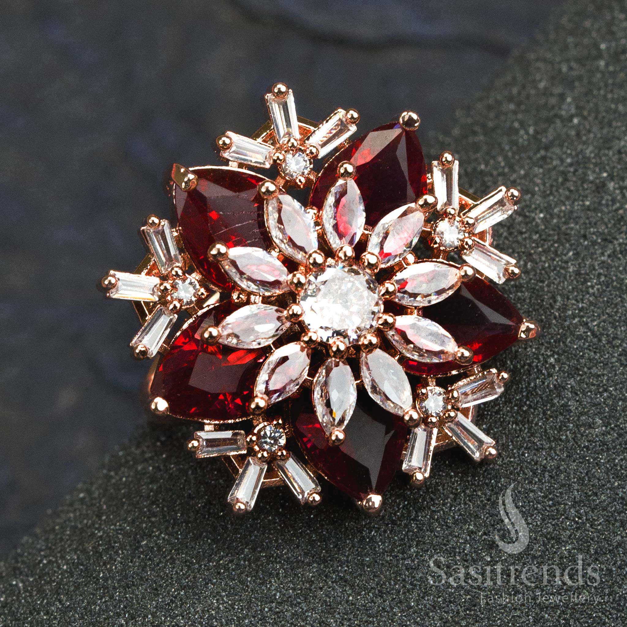 Bold rose gold plated red stone floral designer ring for women with American diamonds and stylish petal carving – perfect for celebrations – Sasitrends