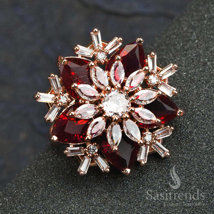 Bold rose gold plated red stone floral designer ring for women with American diamonds and stylish petal carving – perfect for celebrations – Sasitrends