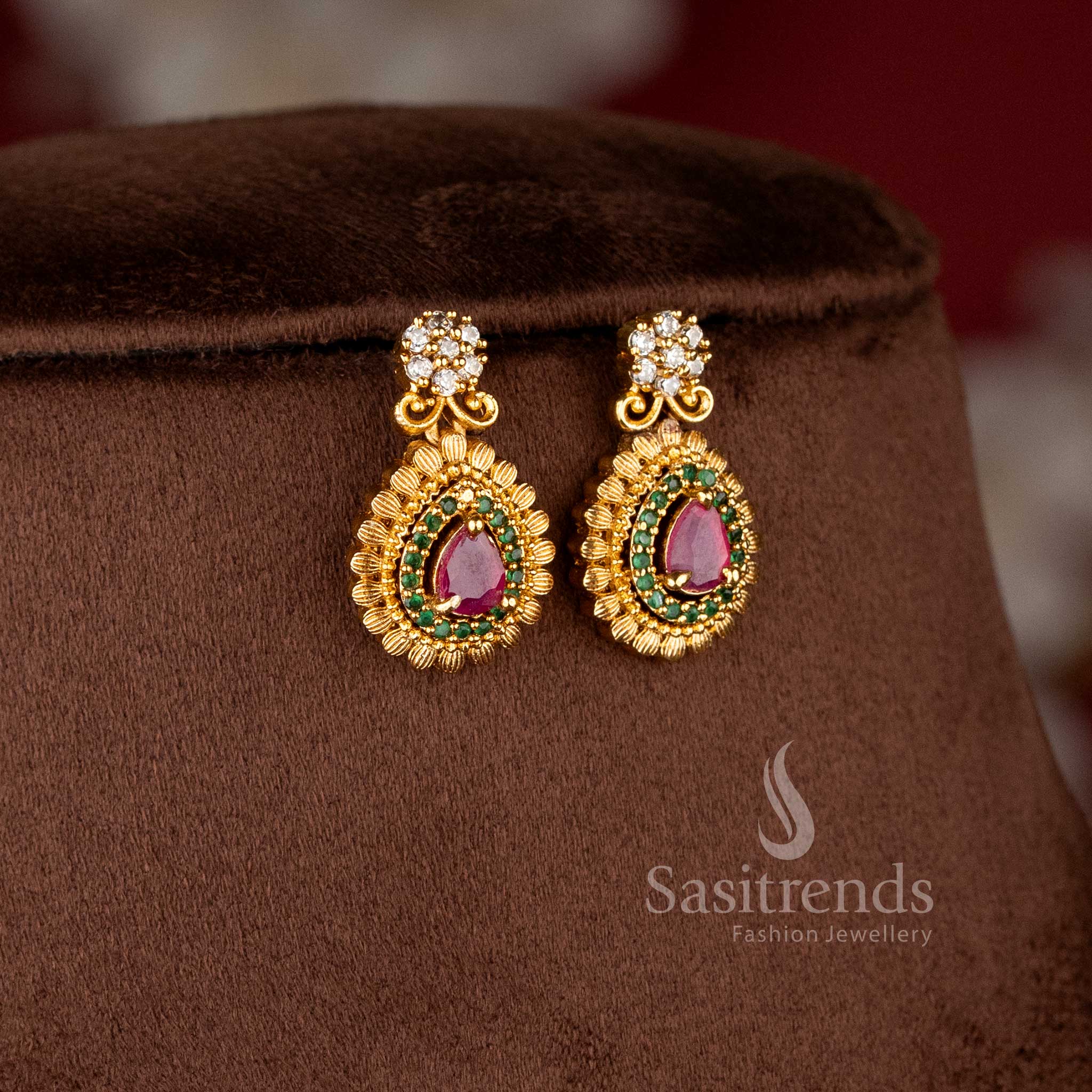 Matching pear-cut drop earrings with stone-studded borders and matte gold finish from the temple jewellery for wedding collection - Sasitrends