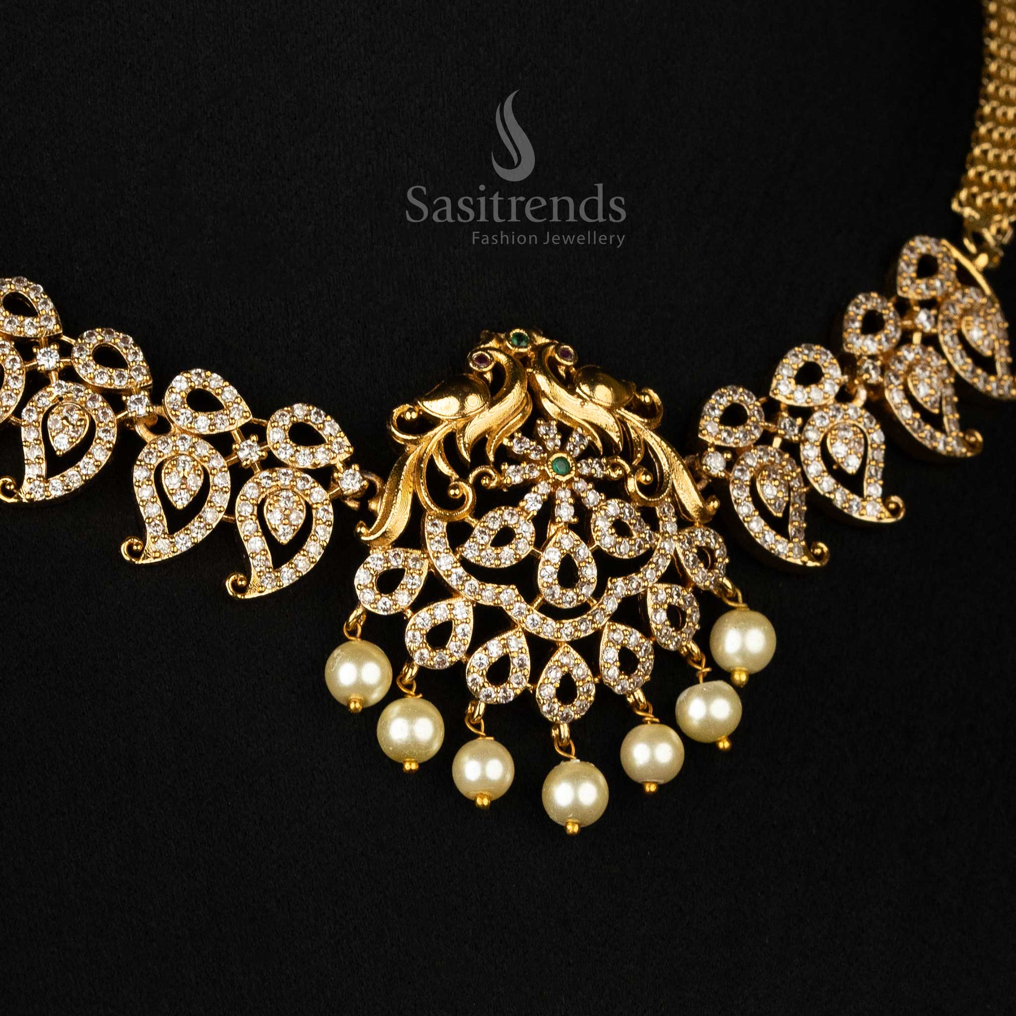 Close-up of a peacock motif choker set with AD stones and matte gold finish for bridal use - Sasitrends