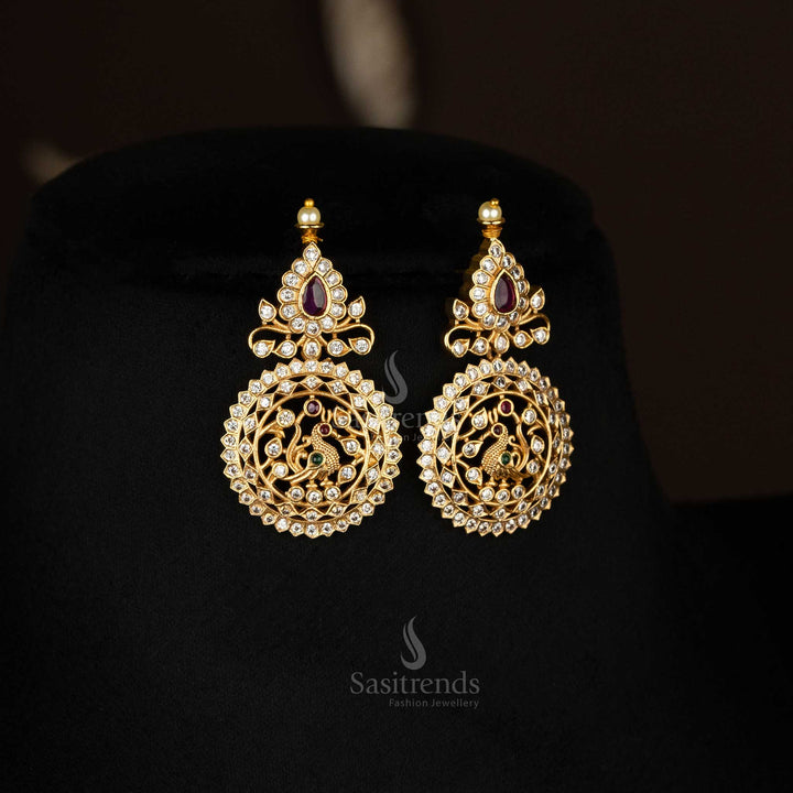 Peacock design bridal Earrings set with temple-style gold tone and dazzling AD stones for traditional occasions - Sasitrends