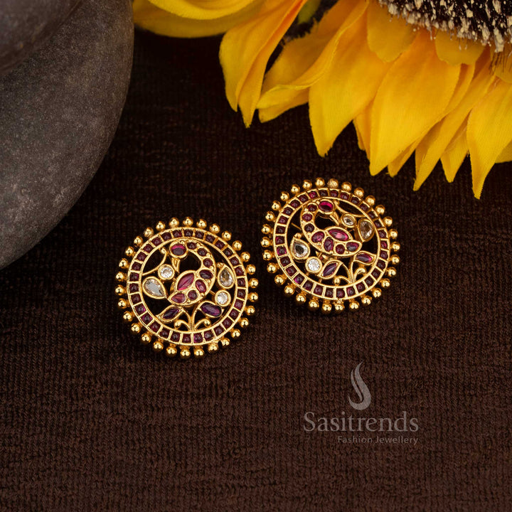 Stylish matte gold plated peacock kemp stone round stud earrings with ruby white accent for festive wear - Sasitrends