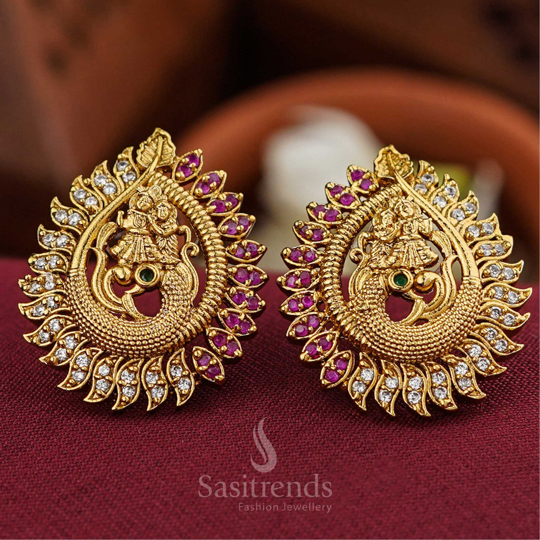 Radha Krishna on peacock temple stud earrings in ruby-white with AD stones, embodying spiritual aura, festive elegance, and temple-crafted brilliance by Sasitrends