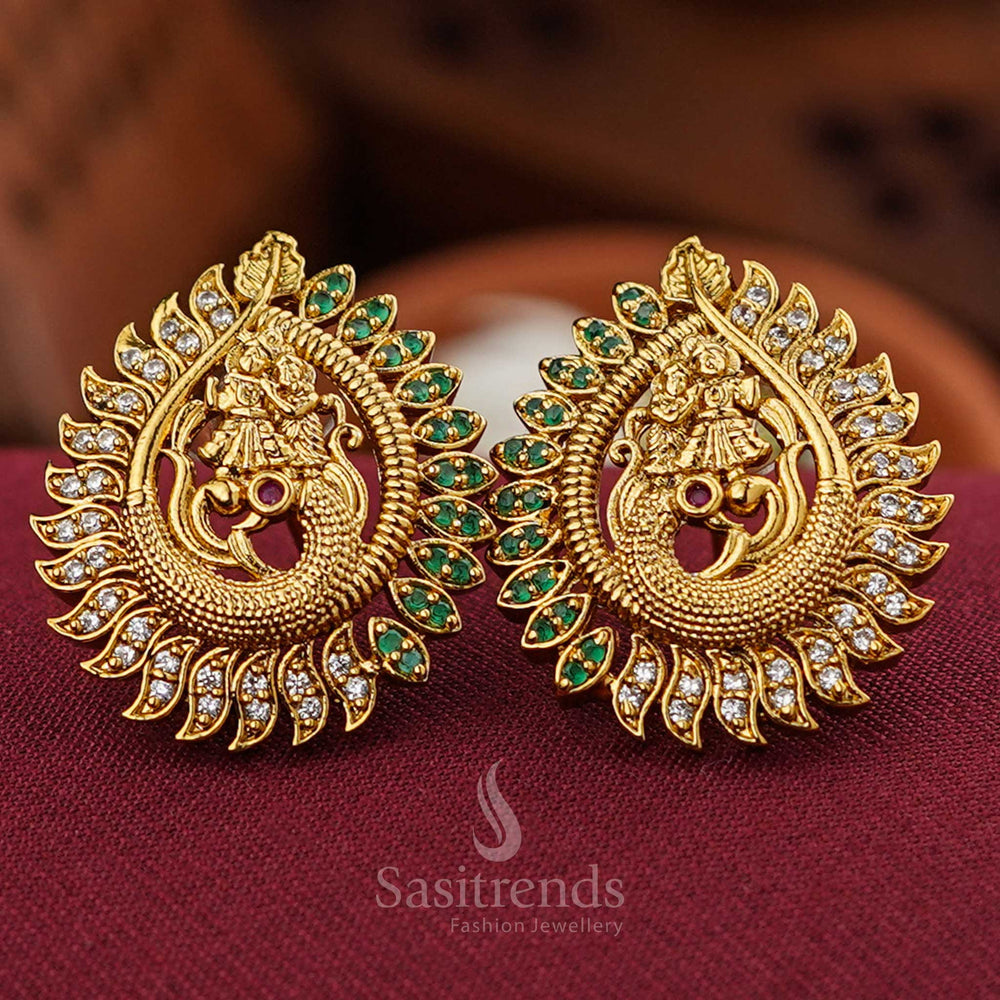 Temple gold Radha Krishna earrings with green-white AD peacock studs, crafted in heritage style with tranquil finish and ethnic spark for cultural celebrations by Sasitrends