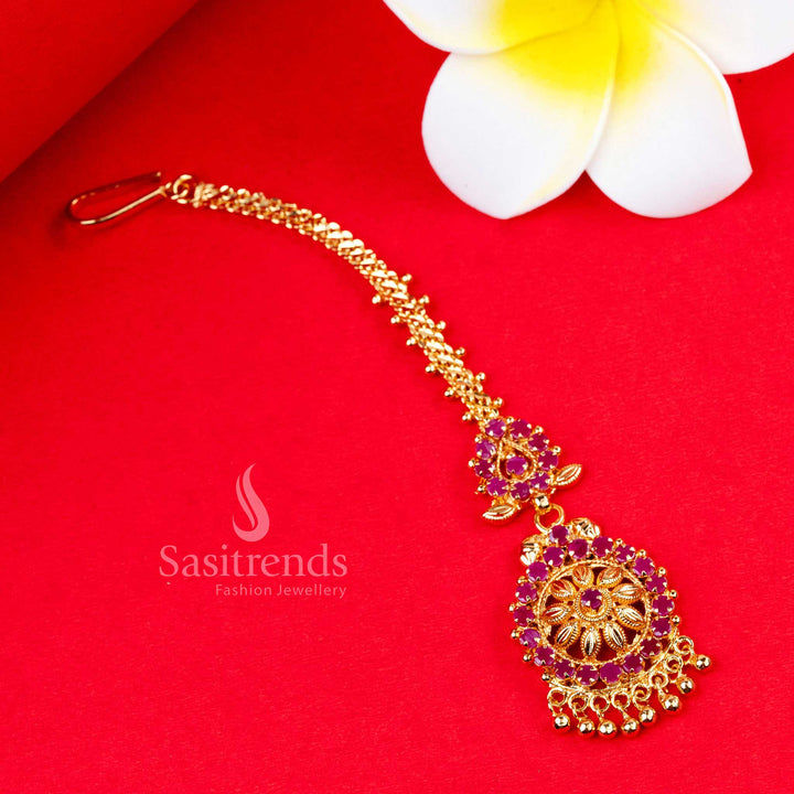 Exquisite and traditional ruby-red floral motif micro gold plated maang tikka with sparkling AD stones - Sasitrends