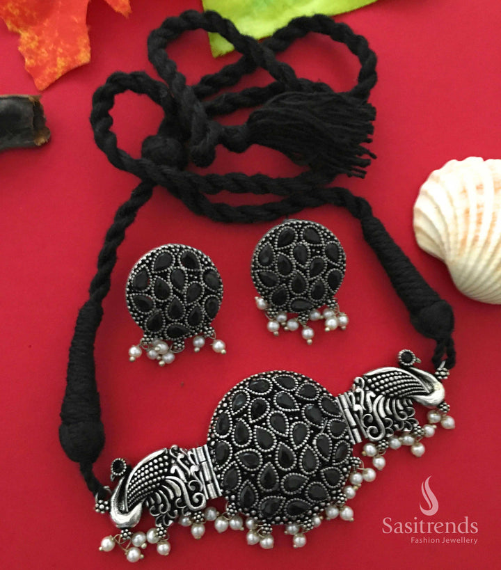 Majestic black peacock design oxidised choker necklace featuring intricate stone work and pearl drops, evoking a vintage tribal charm – Jewellery from Sasitrends

