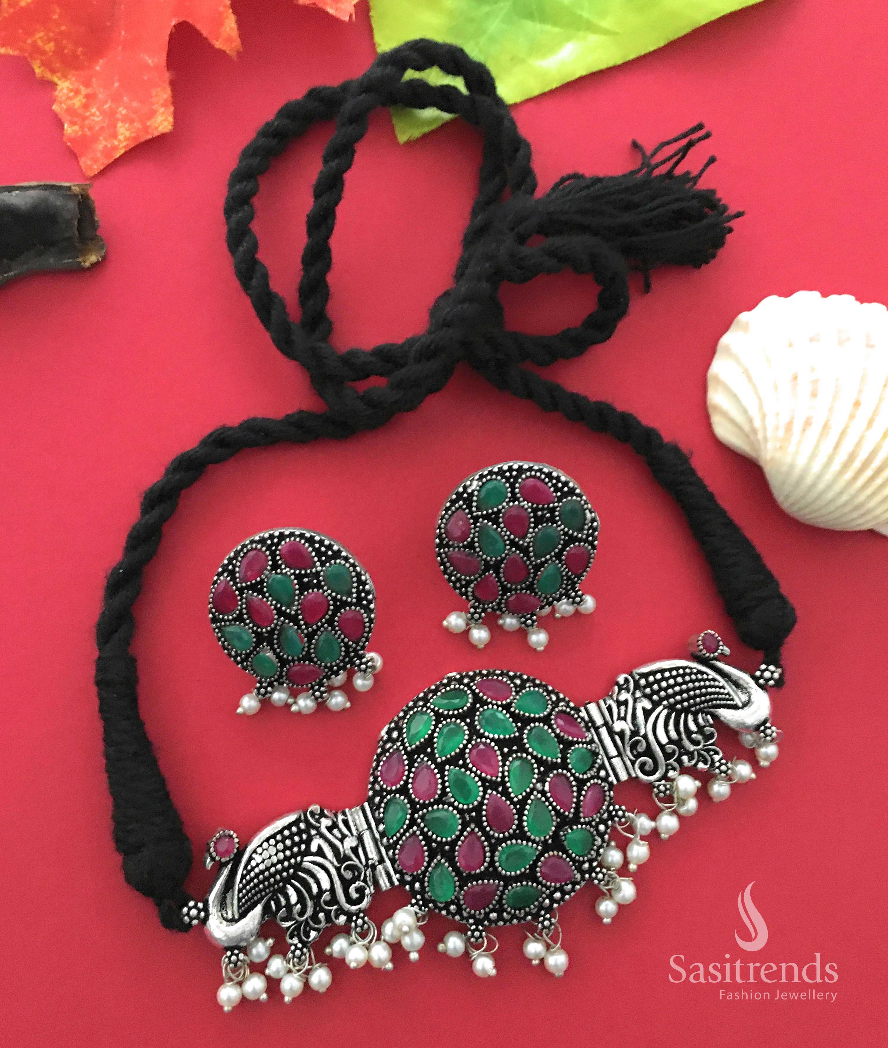 Royal ruby-green oxidised silver choker necklace with divine peacock motif, enriched with stones and pearl hangings—temple inspired elegance – Jewellery by Sasitrends