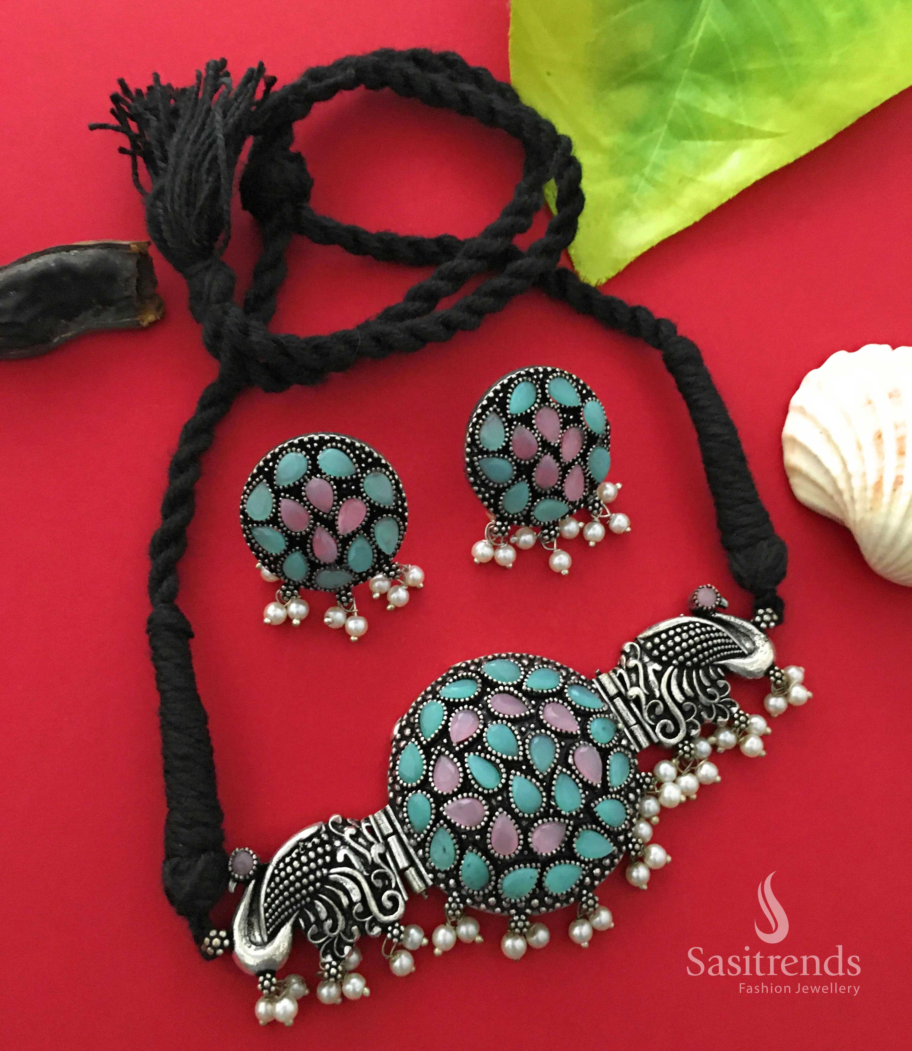 Graceful oxidised silver peacock choker necklace in pink-mint tones with artistic stone placements and dangling pearls, blending elegance and tradition – Jewellery from Sasitrends