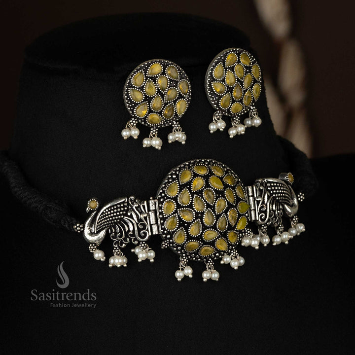 Stylish oxidised silver choker necklace with yellow stone accents, featuring a peacock design and pearl earrings for a complete set - Sasitrends