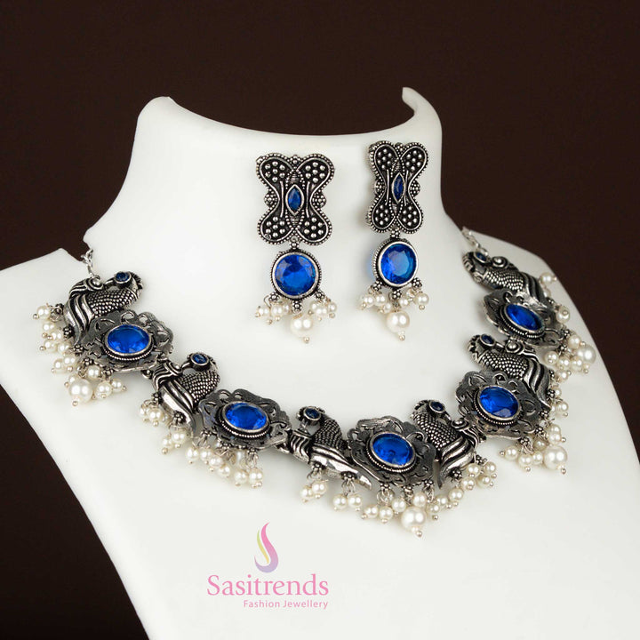 Blue oxidised silver jewellery set with floral and peacock motifs and pearl drops, an elegant long necklace with earrings for a festive look – Sasitrends