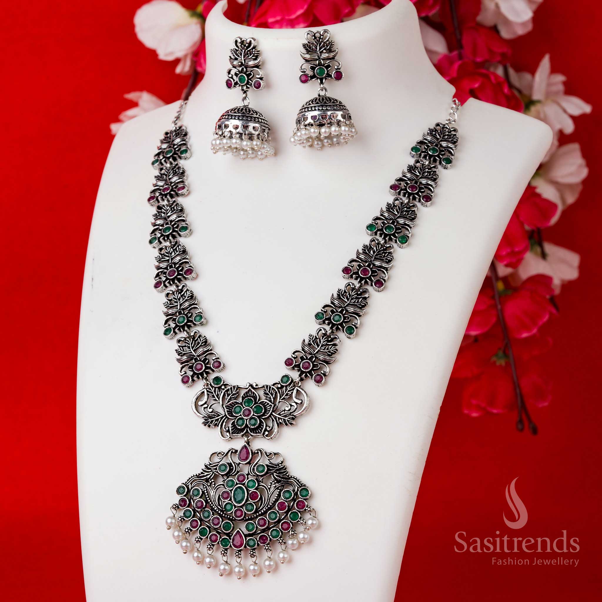 Traditional ruby-green floral pendant set in oxidised silver with pearl jhumkas, designed for rich festive and party wear styling – Sasitrends