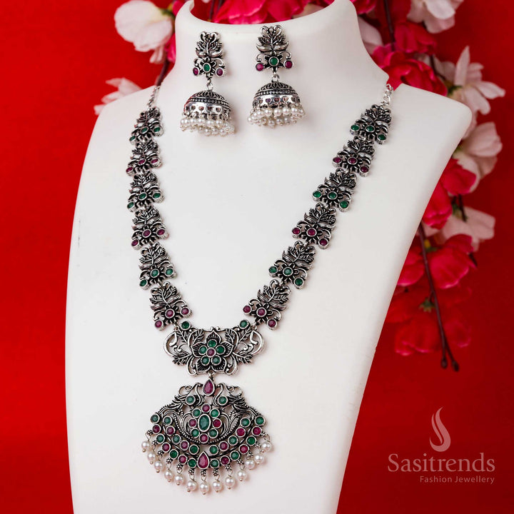 Traditional ruby-green floral pendant set in oxidised silver with pearl jhumkas, designed for rich festive and party wear styling – Sasitrends