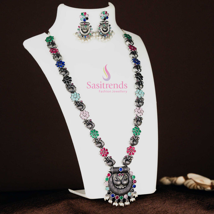 Traditional oxidised silver long necklace featuring a majestic peacock chandbali pendant and multi-colour stone accents, paired with matching earrings, a classic festive jewellery set – Sasitrends